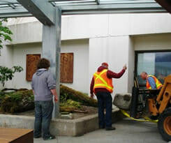 Morgan Nichols worked with Airport staff, Mark Lykins and Dana Ritter, who used heavy equipment to move large logs and boulders into place.